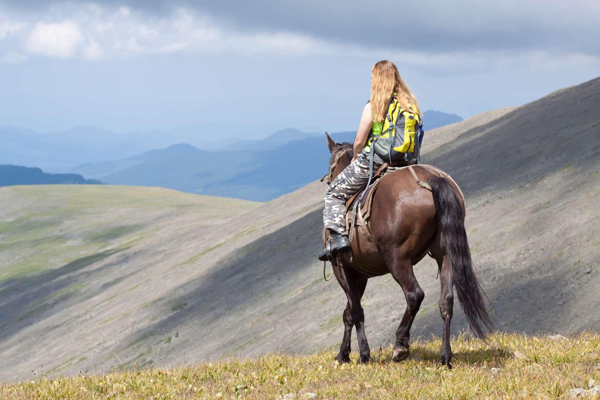 rider-with-backpack-horseback
